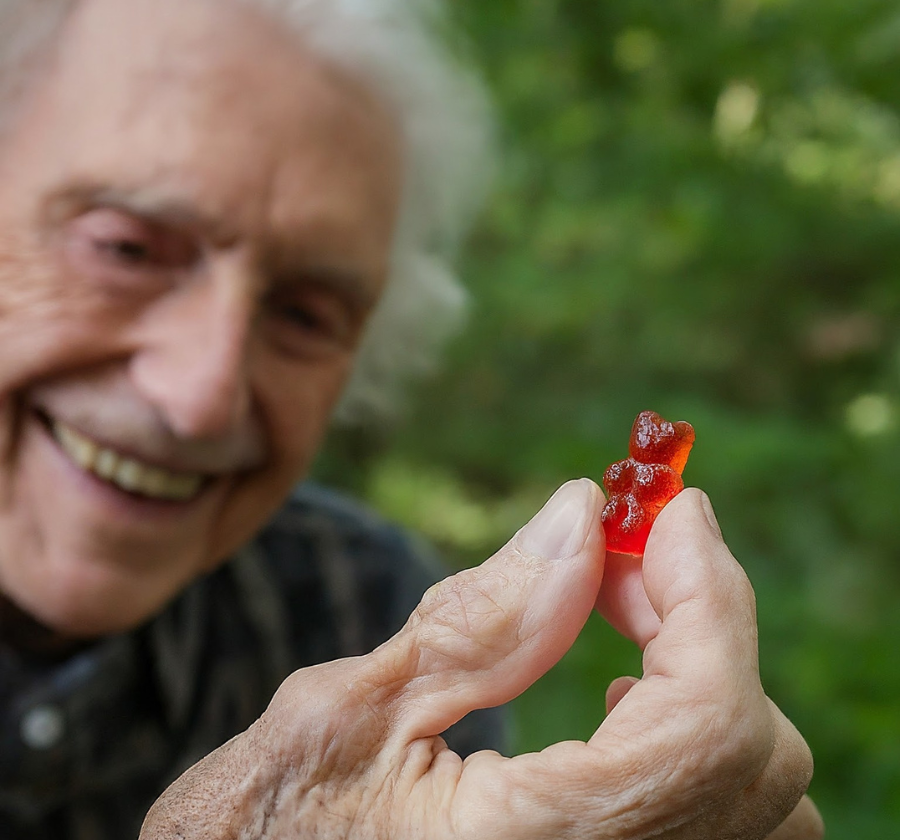 kush.com__old_person_enjoying_cbd_gummies